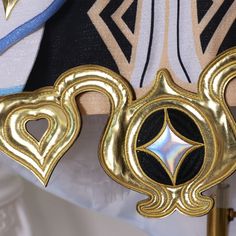 a close up view of the back of a cosplay's costume with gold accents