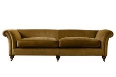 a brown couch sitting on top of a white floor