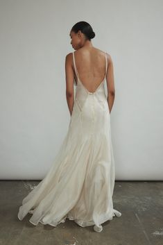 the back of a woman in a white dress