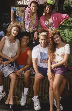 a group of people that are sitting on a bench