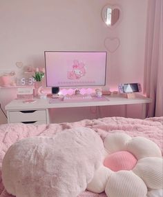 a bedroom with pink walls, white furniture and a large bean bag pillow on the bed