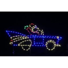 a lighted horse drawn carriage with lights on it's sides and the front wheels