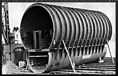 an old black and white photo of a large pipe