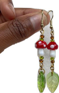 Adjustable Green Mushroom Design Earrings, Green Adjustable Mushroom Design Earrings, Adjustable Green Earrings With Mushroom Design, Funky Handmade Dangle Jewelry, Fun Mushroom Design Jewelry For Gifts, Fun Mushroom Design Jewelry Gift, Funky Adjustable Dangle Earrings, Funky Red Handmade Jewelry, Whimsical Adjustable Beaded Dangle Earrings