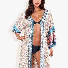 The Anna-Kaci Women's Bohemian Long DusterCover-Up with Floral Paisley Print and Wide Sleeves is a stunning and versatile addition to your wardrobe. Crafted from lightweight, breathable fabric, this Dusterfeatures a beautiful floral paisley print that exudes bohemian charm and elegance. The long, flowing design and wide sleeves provide a relaxed and comfortable fit, perfect for layering over swimsuits, dresses, or casual outfits. Ideal for beach days, poolside lounging, or adding a chic touch to Bohemian Printed Open Front Tops, Bohemian Open Front Printed Tops, White Paisley Print Top For Beach, Blue Paisley Print Beach Top, Beach Blue Tops With Paisley Print, Bohemian Paisley Print Beach Tops, Bohemian Blue Open Front Top, Flow Design, Crochet Cover Up