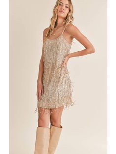 Be the life of the party in this fabulous Light Up Mini Dress! The shimmering gold fabric is sure to make you shine and the dazzling sparkly fringe detail is sure to wow your friends. For a little extra sparkle, there are also spaghetti straps that'll keep you feeling secure and super stylish! On your mark, get set- GLAM! Gold Fringe Dress, Gold Flapper Dress, Gold Sparkle Dress, Short Sparkly Dresses, Gold Sparkly Dress, Gold Flapper, Gold Sparkle Dresses, Sequined Mini Dress, Feeling Secure