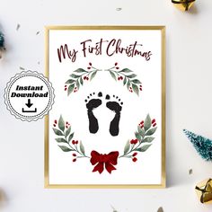 a christmas card with the words, my first christmas on it and an image of two feet