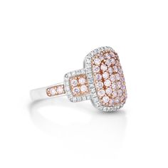 This exquisite 0.72 Cts Pink Diamond and White Diamond Ring in 14K Two tone Gold is a true treasure. With its stunning design and high-quality materials, it exudes elegance and sophistication. The 0.19 Cts White Diamond and 3.86Grams Metal add an extra touch of luxury, making it a valuable addition to any jewelry collection. Luxury Sapphire Cluster Ring With Diamond Accents, Luxury Cluster Diamond Ring With Halo Setting, Dazzling Rose Gold Baguette Cut Rings, Elegant Sapphire Ring With Vvs Clarity Cushion Cut, Luxury Cluster Rings With Halo Setting, Exquisite Rose Gold Diamond Ring With Vvs Clarity, Luxury Cluster Rings With Pave Setting, Elegant Pink Cluster Diamond Ring, Classic Pink Diamond Cluster Ring