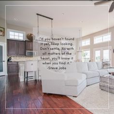 a living room filled with furniture and a quote