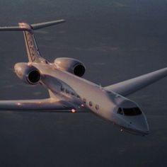 an airplane is flying in the sky at night