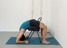 a man is doing exercises on a chair