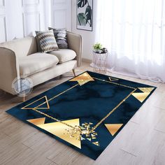 a blue area rug with gold triangles and chains on the floor in front of a couch