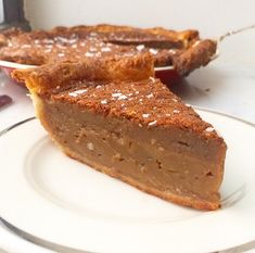 two slices of pie sitting on top of a white plate