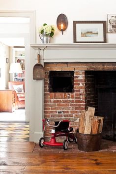 a living room with a fire place and fireplace