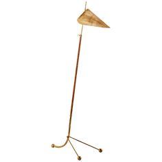 a floor lamp with a wooden shade on it