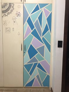 the door is decorated with blue and purple designs on it's glass paneled doors