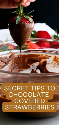 a person dipping chocolate into a bowl with strawberries on the side and text overlay reading secret tips to chocolate covered strawberries