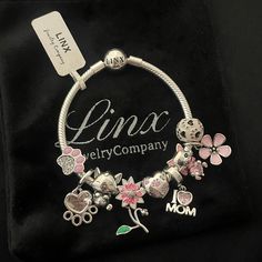 Linx Snake Chain Style Charm Bracelet In 925 Sterling Silver, With A Ball Clasp. The Bracelet Is 3mm In Width And Available In Multiple Lengths. This Bracelet Comes With 9 Linx 925 Sterling Silver Hello Kitty And Friends Charms. Additional Charms Can Be Added Also. All Items Are New And Come In A Luxury Velvet Jewelry Pouch. *Bracelet And Charms Are Excellent Quality 925 Sterling Silver. Personalized Silver Snake Chain Jewelry, Nickel-free Silver Bracelet As Gift For Mom, Nickel-free Silver Bracelet - Gift For Mom, Silver Nickel-free Bracelet As Gift For Mom, Engraved Sterling Silver Charm Bracelet For Mother's Day, Sterling Silver Nickel-free Snake Chain Bracelet, Sterling Silver Bracelets With Lobster Clasp For Mother's Day, Hypoallergenic Sterling Silver Snake Chain Jewelry, Silver Bracelet Jewelry Gift For Mom