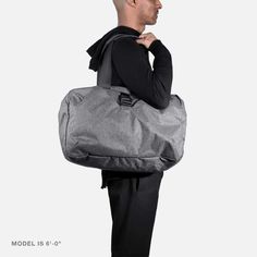 Go Duffel - Heathered Black — Aer | Modern gym bags, travel backpacks and laptop backpacks designed for city travel Versatile Duffle Bag With Functional Pockets For On-the-go, Functional Nylon Luggage For On-the-go, Functional Travel Accessories With Pockets For On-the-go, Functional Weekender Bag With Pockets For On-the-go, Nylon Travel Bag With Pockets For On-the-go, Functional Nylon Duffle Bag For Everyday Use, Packable Nylon Travel Accessories For Overnight Trips, Versatile Duffle Bag For Outdoor Activities, Casual Packable Travel Bag For Overnight Trips