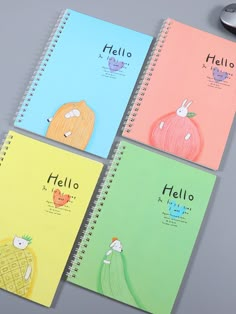 four notebooks with the words hello written in different colors and designs on each page