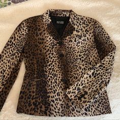 Moschino Leopard Print Jacket Lined In Black, Made In Italy 75% Acetate, 20% Polyester, 5% Elastane. Dry Clean Only. Designer Silk Blazer For Fall, Silk Long Sleeve Business Casual Outerwear, Silk Long Sleeve Outerwear For Business Casual, Winter Silk Blazer For Work, Fitted Silk Outerwear For Fall, Fall Semi-formal Silk Outerwear, Elegant Brown Silk Outerwear, Cheetah Print Jacket, Leopard Print Faux Fur Coat With Lining