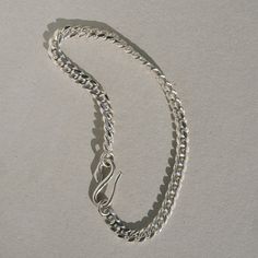 Inspired by the Roman “Good Goddess” Bona Dea, who was associated with serpents and snake-charming. A dependable curb chain bracelet. DETAILS hand cast snake clasp in sterling silver 4.3 mm sterling silver curb chain Choose 6.5 or 7 inches Minimalist Silver Cuban Link Bracelet With Curb Chain, Classic Sterling Silver Curb Chain Bracelet For Everyday, Silver Cuban Link Bracelet With Lobster Clasp As Gift, Everyday Cuban Link Bracelets With Lobster Clasp, Sterling Silver Cuban Link Jewelry With Lobster Clasp, Sterling Silver Cuban Link Bracelet Gift, Minimalist Sterling Silver Chain Bracelet With Curb Chain, Everyday Sterling Silver Bracelet With Curb Chain, Everyday White Gold Curb Chain Bracelet