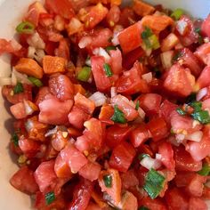 a white bowl filled with chopped up vegetables