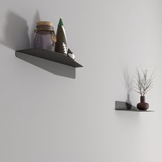 there are two shelves on the wall and one shelf is holding various items in it