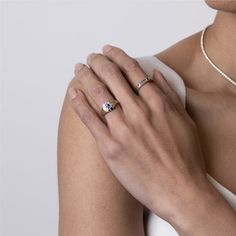 a woman's hand with a ring on it