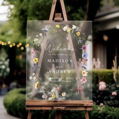 an easel with a wedding sign on it