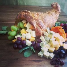 a bunch of food that is sitting on a wooden table with the caption's page below it