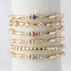 This dainty birthstone stackable ring is unlike any other, the band has a unique design all around which gives a bit of antique feel. Perfect gift for July birthdays! * Stock size: US 7 * Genuine 1.5mm blue sapphire * Band width: ≈1.75mm * Setting size: ≈2mm * Material: 14k solid yellow gold (rose gold or white gold option available) * Made of 100% recycled precious metal and ethically sourced gemstone * Comes in a gift box with a bow ready for gifting * Handmade with love and great care in New Promise Ring With Birthstone In Recycled Gold, Recycled Gold Birthstone Ring For Promise, Yellow Gold Sapphire Stackable Rings With Bezel Setting, Dainty Stackable Sapphire Ring For Anniversary, Yellow Gold Birthstone Ring In Recycled Gold, Dainty Diamond Stackable Rings With Birthstone, Dainty Diamond Birthstone Stackable Rings, Fine Jewelry Sapphire Stackable Rings With Bezel Setting, Dainty Blue Sapphire Stackable Ring