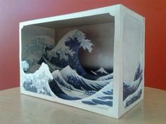 an origami box with the great wave on it