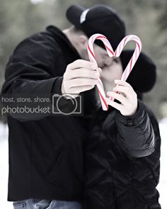 a man holding a candy cane in front of his face with the caption christmas, your way net images may be subject to copyright - send