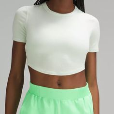 This Lightweight Everyday Top Has Just The Right Softness, Just The Right Stretch, And A Snug Fit That Feels Like A Second Skin. Size 2, Delm Color Code Designed For On The Move Soft, Ribbed Modal Fabric Tight Fit, Cropped Length Green Ribbed Athleisure Top, White Ribbed Yoga Top, White Ribbed Top For Yoga, White Ribbed Activewear For Workout, Fitted Ribbed Sports Top, Ribbed Fitted Sports Top, White Ribbed Spring Activewear, Fitted Ribbed Yoga Tops, White Fitted Ribbed Activewear