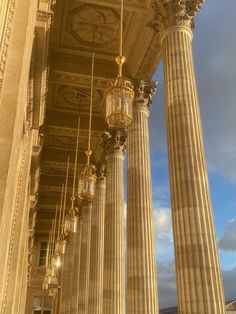 columns and chandeliers line the sides of an ornate building