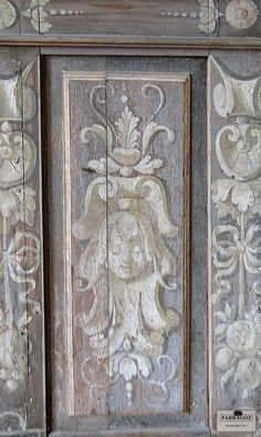 an old wooden cabinet with carvings on it