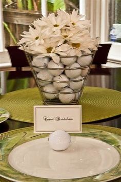 there is a vase with white flowers on it and a place card in the middle