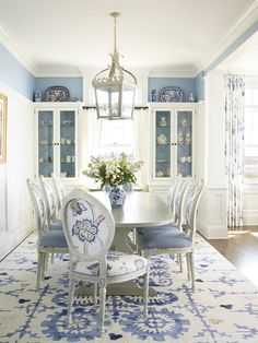 a dining room with blue and white decor