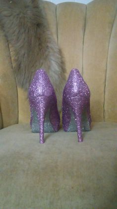 Lavender purple covers the entire top portion of the heels while the underside is covered in an ultra fine sliver glitter. These heels can be made in any color combo desired. If you would like another color combination please leave your color choices at checkout. This heel is available in additional colors and shoe styles. Contact us today for more color and style options. All heels are handmade and shipped out within 1-2 weeks of the purchase date. We always welcome new designs and love to work Lavender Open Toe Heels For Party, Lavender Heels With Pointed Toe For Party, Purple Heels With 4-inch Almond Toe, Lavender Round Toe Heels For Party, Lavender Pointed Toe Heels For Party, Purple Almond Toe Heels With 4-inch Heel, Purple Glitter High Heels, Hand Painted Heels, Heels Closed Toe