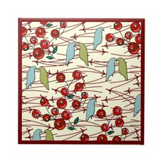 a square tile with birds on branches and cherries in red, green and blue