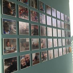 a wall with many pictures hanging on it