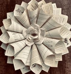 an origami flower made out of old book pages