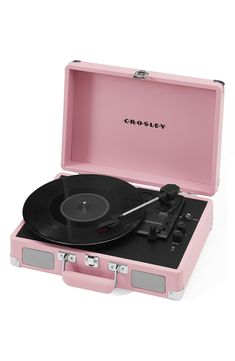 a pink suitcase with a record player in it