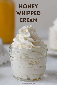 a jar filled with whipped cream sitting on top of a table