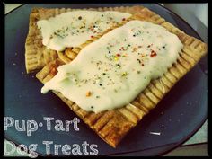 two waffles topped with white frosting and sprinkles on a plate