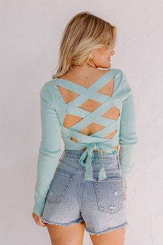 You are sure to have a summer of fun in this darling aqua colored top featuring lightweight material, a square neckline, long loose sleeves, a wide lace-up back, and a flattering silhouette that ends in a straight cropped hemline! Measurements S : Bust 26", Hip 22", Length 15.5", Sleeve Length 25", Waist 24". M : Bust 28", Hip 24", Length 16", Sleeve Length 25.5", Waist 26". L : Bust 30", Hip 26", Length 16.5", Sleeve Length 26", Waist 28". Long Sleeve Tie Back Top For Brunch, Spring Long Sleeve Tie-back Top, Spring Long Sleeve Tie Back Tops, Spring Long Sleeve Top With Tie Back, Casual Spring Tops With Lace-up Back, Blue Square Neck Crop Top For Spring, Long Sleeve Tie Back Tops For Fall, Spring Stretch Tops With Lace-up Back, Light Blue Long Sleeve Crop Top For Spring