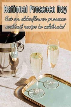 two glasses of champagne sitting on top of a table