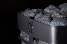 a close up of rocks in a container with the word hux on it's side