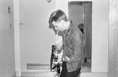 a man brushing his teeth with an electric toothbrush